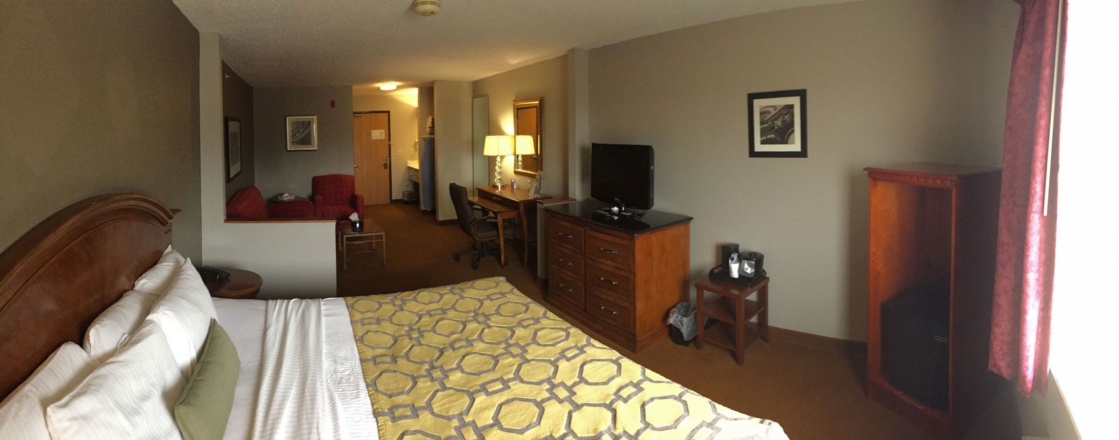 Desk, laptop workspace, iron/ironing board, free cribs/infant beds