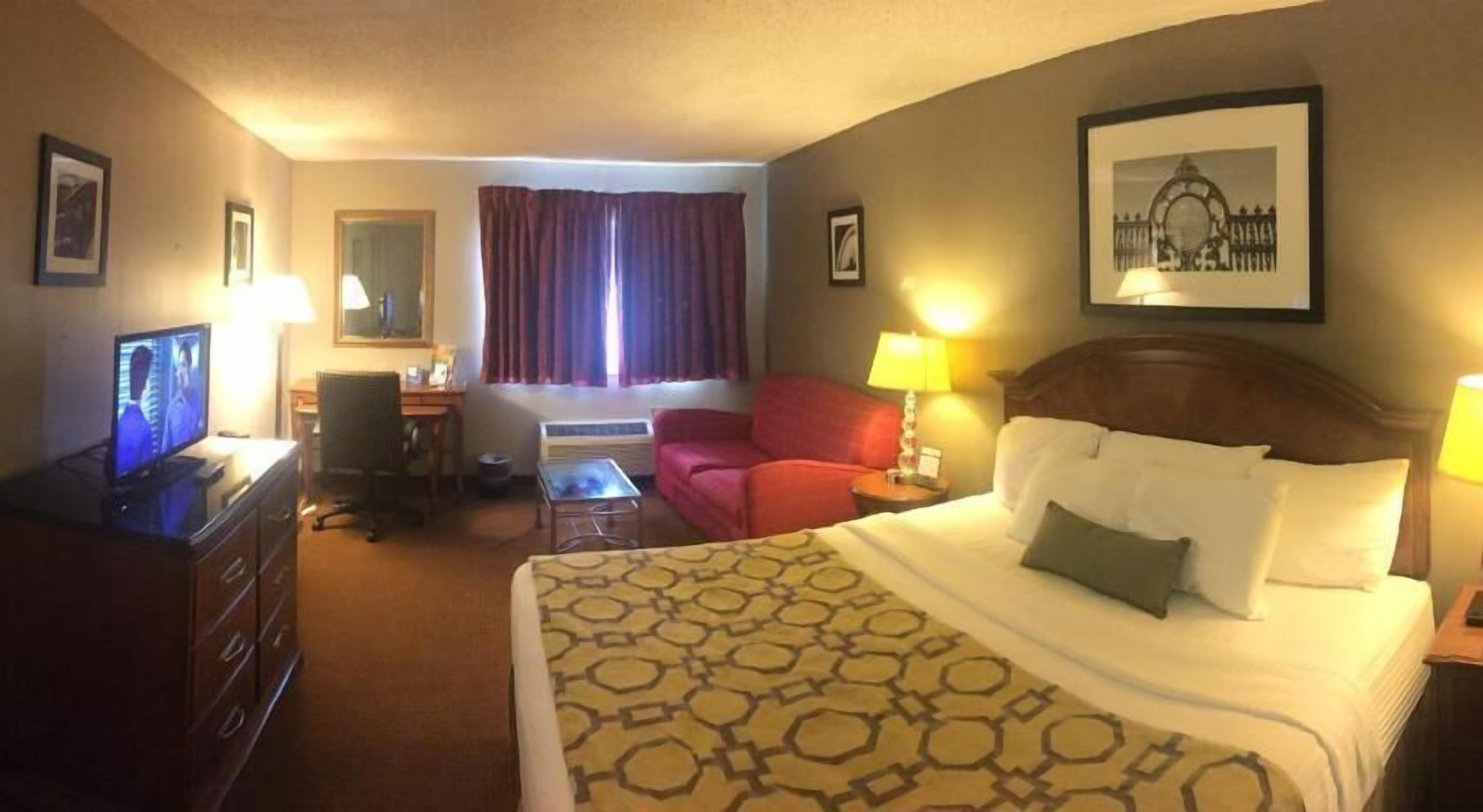 Desk, laptop workspace, iron/ironing board, free cribs/infant beds