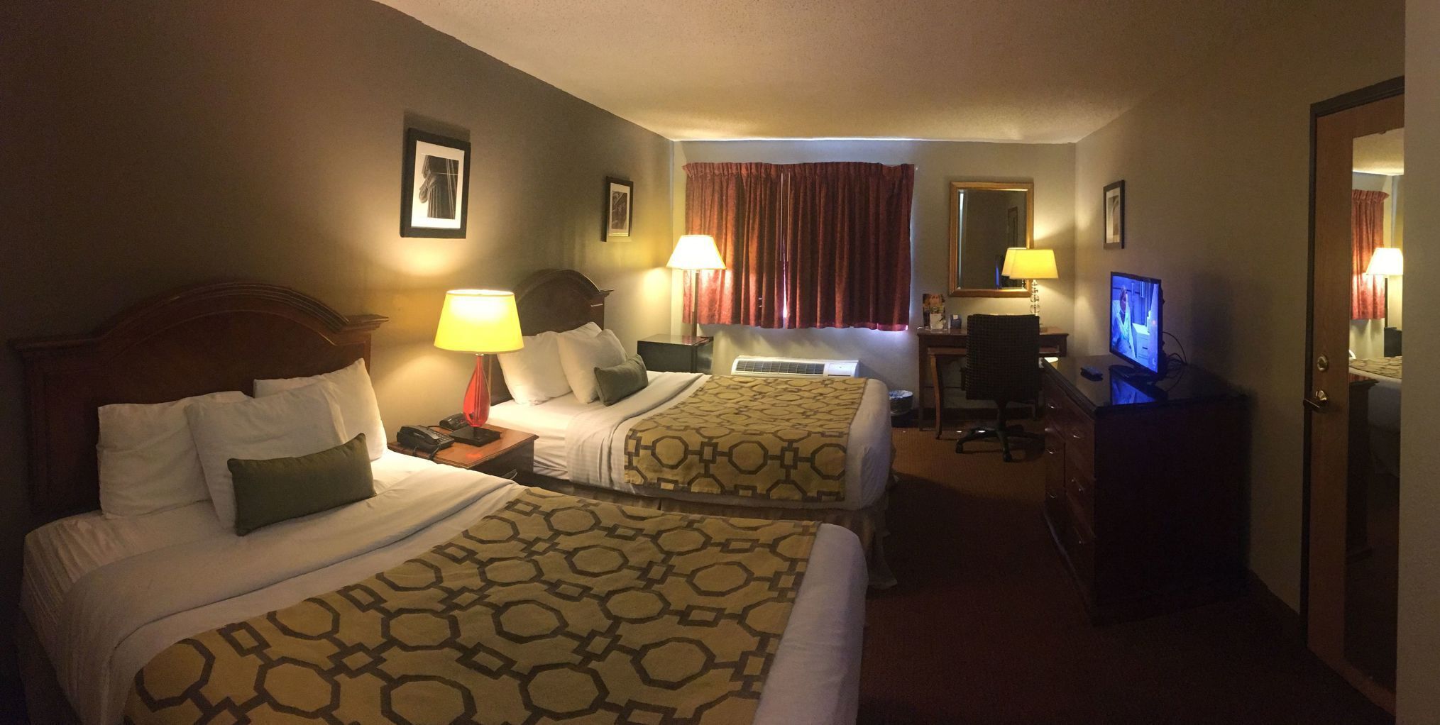 Desk, laptop workspace, iron/ironing board, free cribs/infant beds