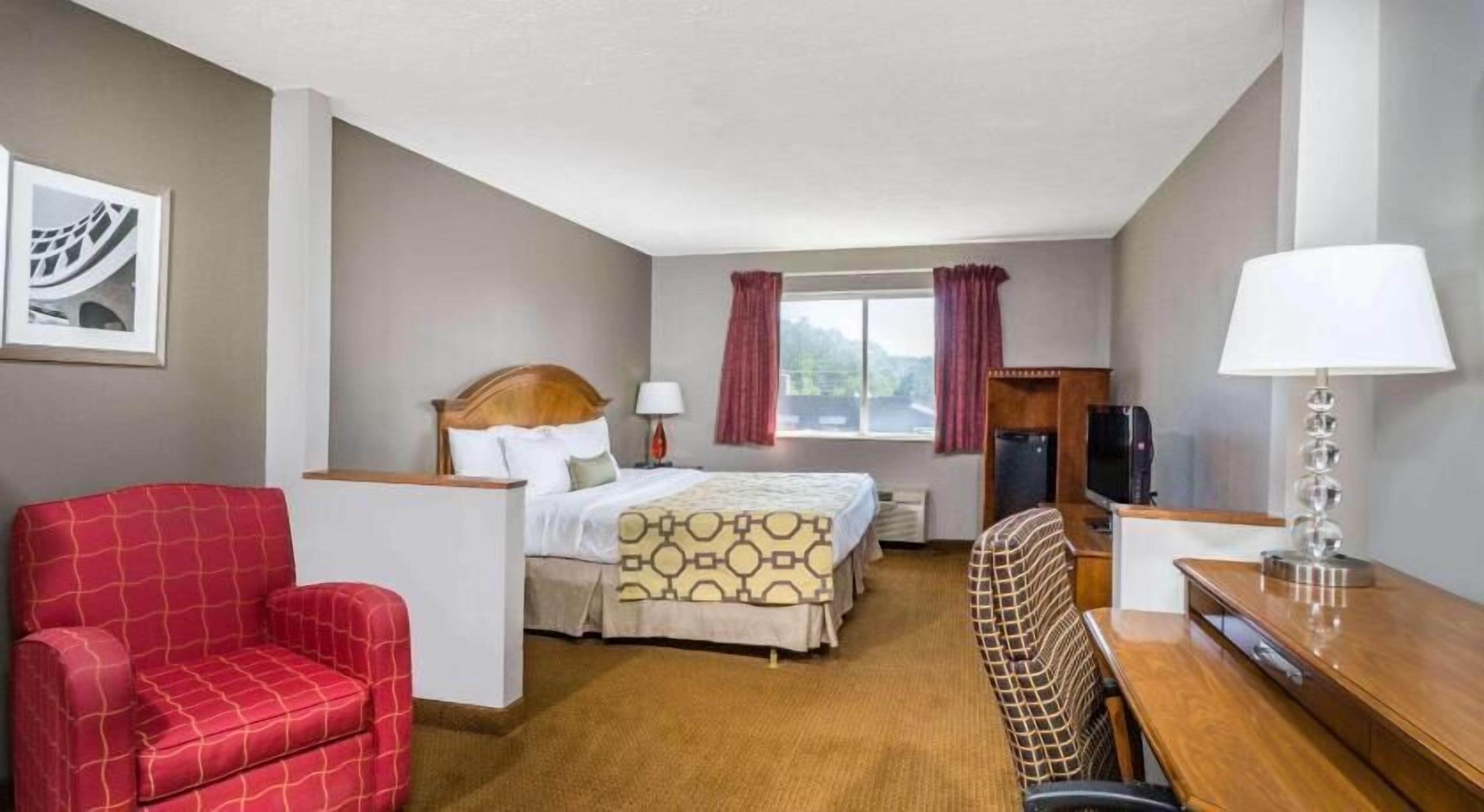 Desk, laptop workspace, iron/ironing board, free cribs/infant beds