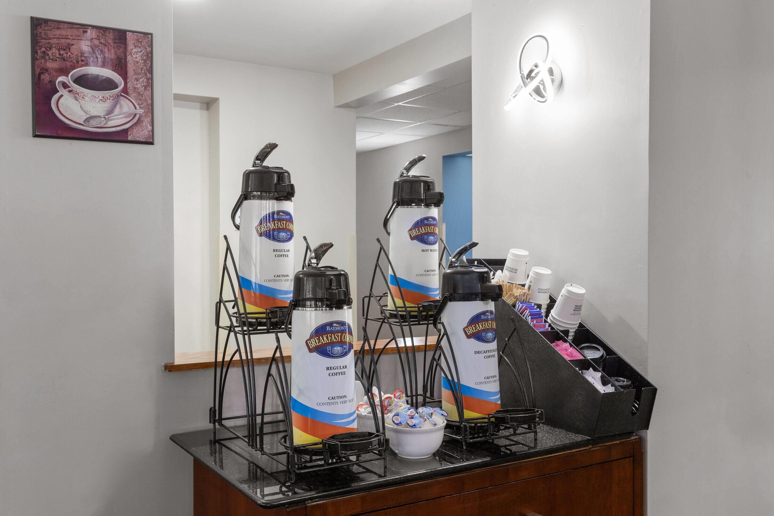 A coffee station with dispensers labeled 'Breakfast Coffee' and 'Decaffeinated Coffee'.