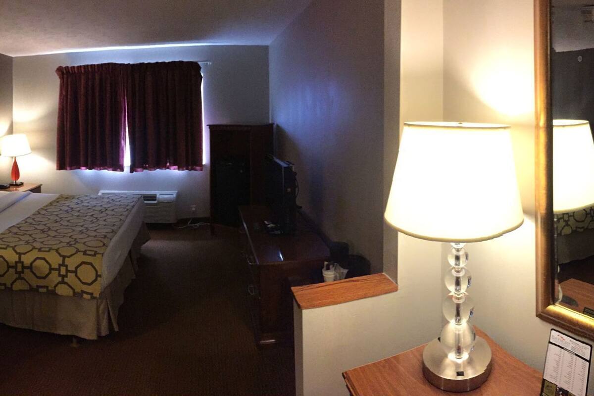 Desk, laptop workspace, iron/ironing board, free cribs/infant beds