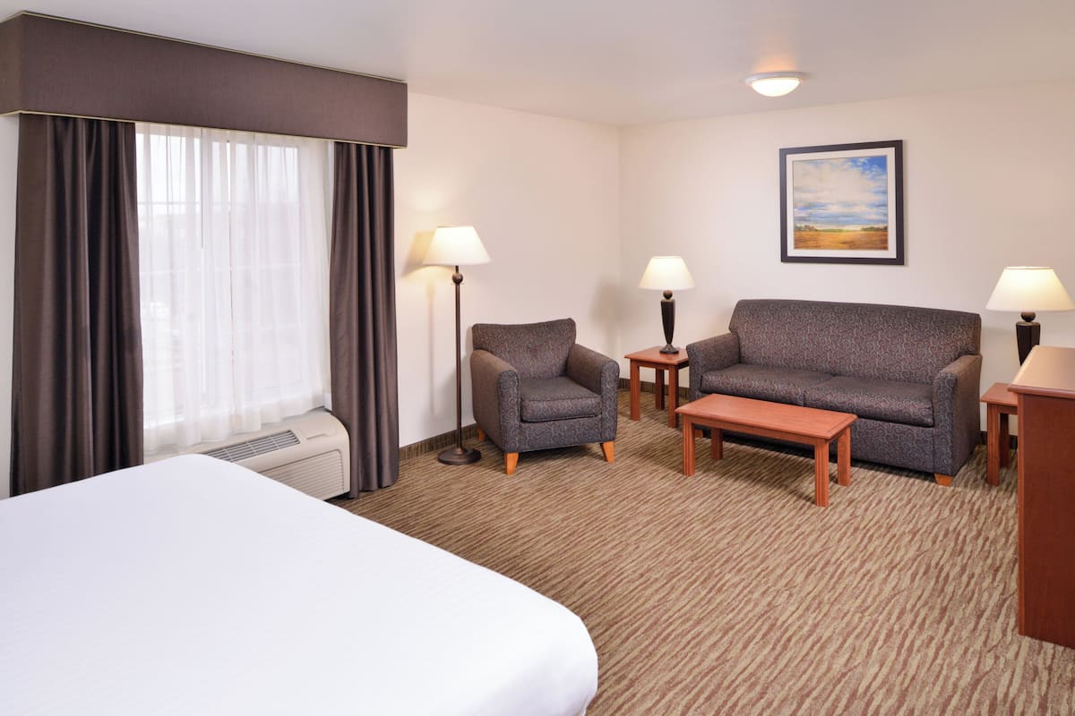 Suite, 1 King Bed with Sofa bed (Dining) | Desk, blackout curtains, iron/ironing board, free WiFi