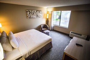 Premium bedding, desk, laptop workspace, iron/ironing board