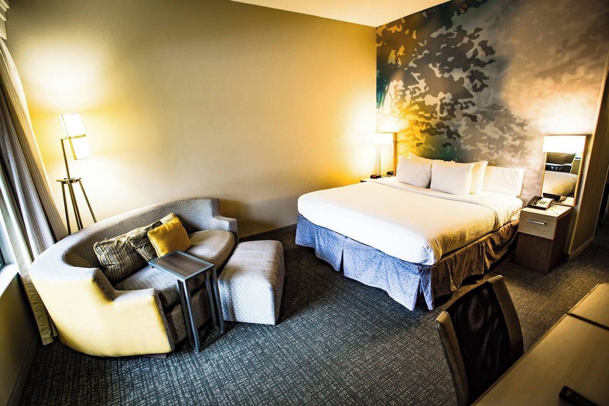 Premium bedding, desk, laptop workspace, iron/ironing board