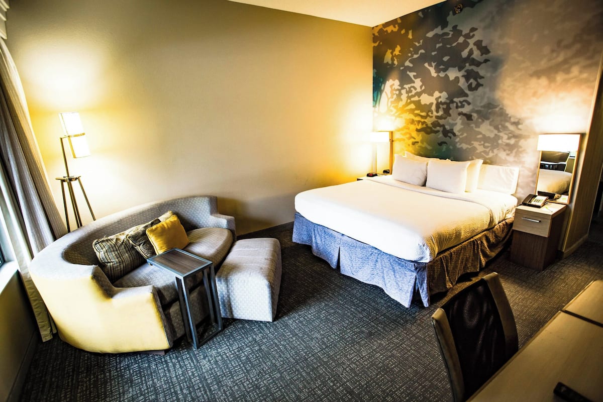 Premium bedding, desk, laptop workspace, iron/ironing board