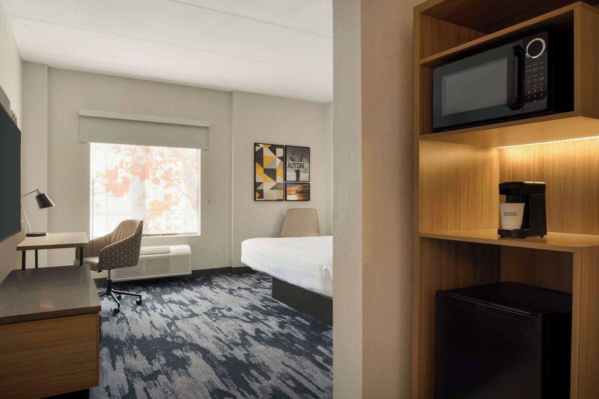 Pillow-top beds, desk, blackout curtains, iron/ironing board