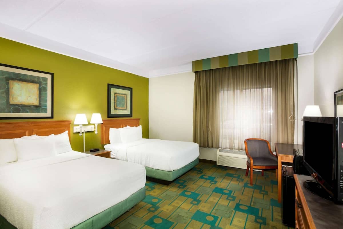 Pillow-top beds, desk, blackout curtains, iron/ironing board