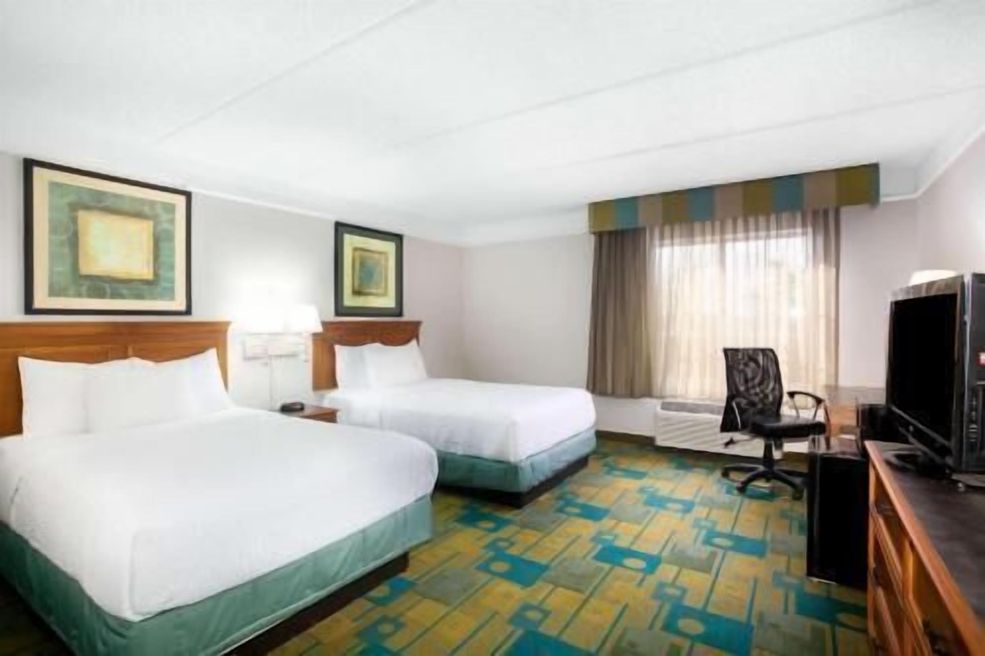 Pillow-top beds, desk, blackout curtains, iron/ironing board