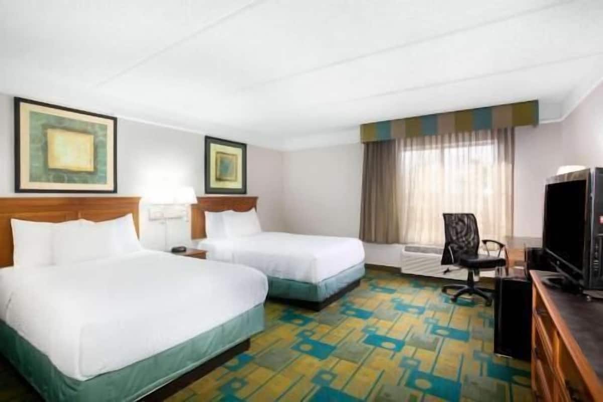 Pillow-top beds, desk, blackout curtains, iron/ironing board