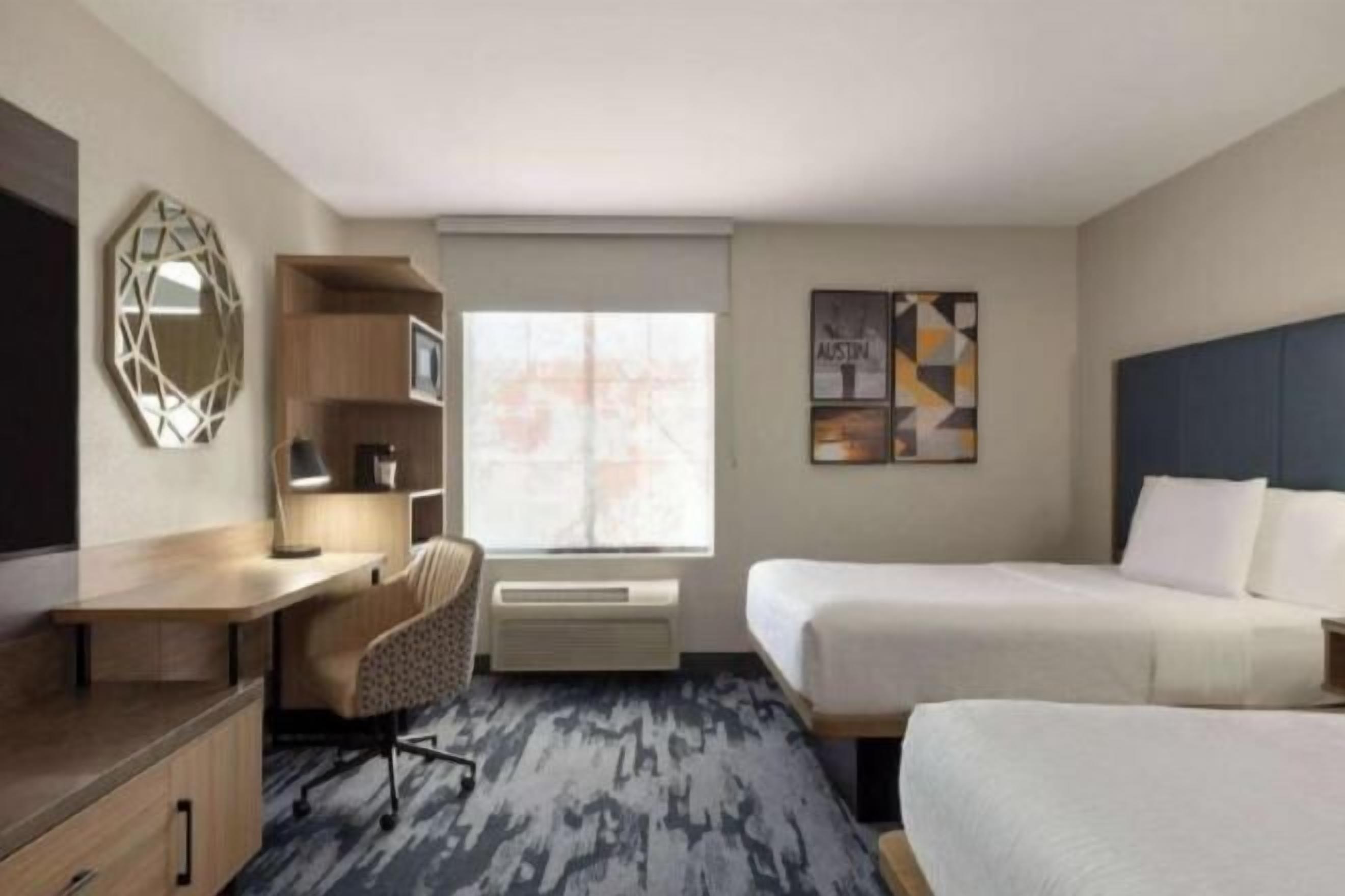 Pillow-top beds, desk, blackout curtains, iron/ironing board