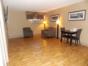 Deluxe Room, 1 King Bed, Kitchenette | Living area | 46-inch LED TV with cable channels, TV