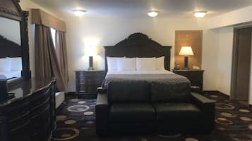 Suite Standard, 1 trÚs grand lit | Salle de séjour | Télévision LED de 46 pouces avec chaßnes par cùble, télévision