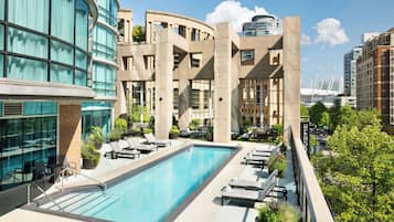 Outdoor pool, open 6:00 AM to 10:00 PM, sun loungers