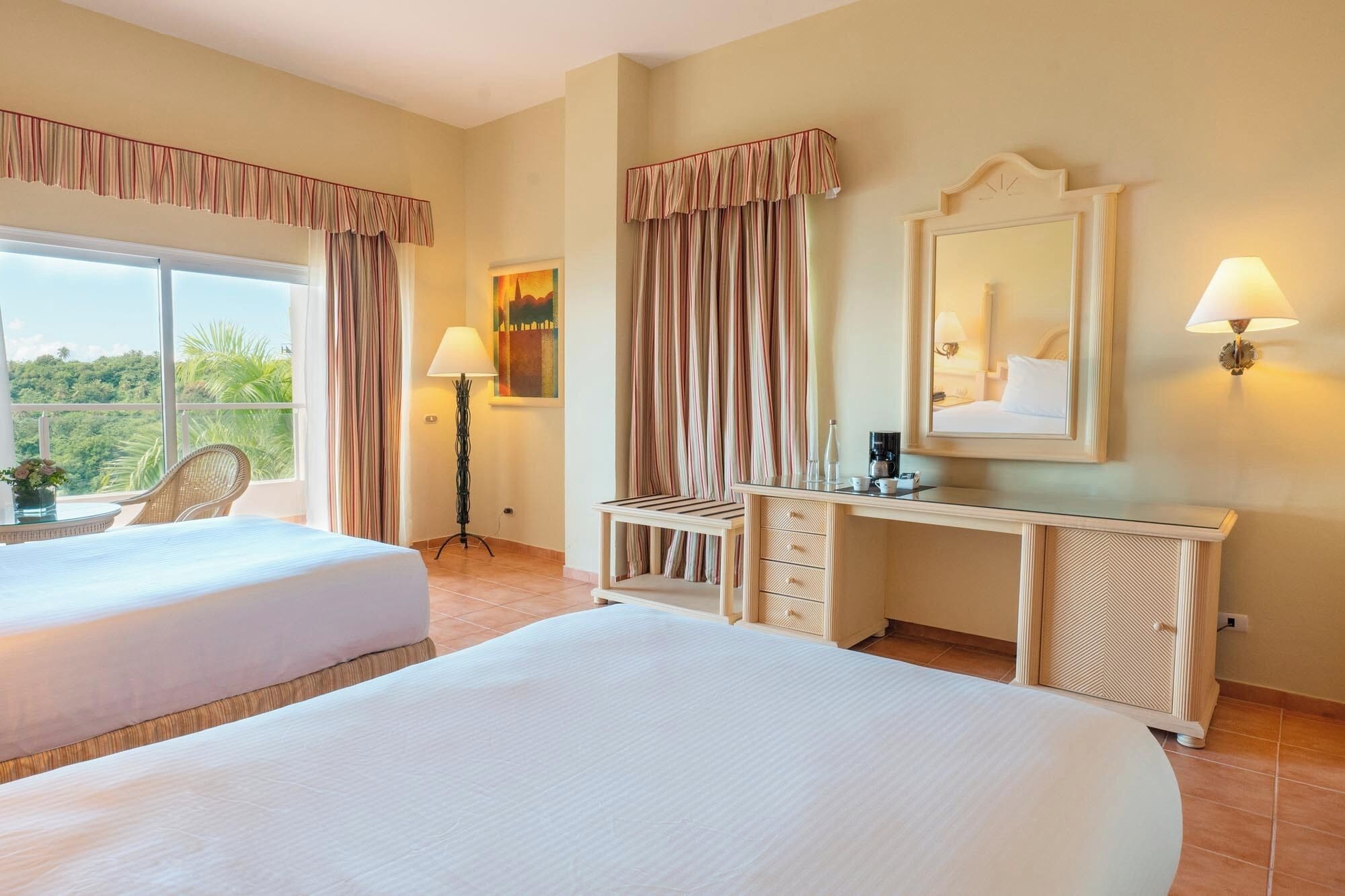 Deluxe Double Room | Minibar, in-room safe, iron/ironing board, free cots/infant beds