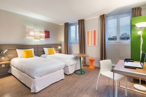 Premium bedding, Select Comfort beds, laptop workspace, blackout drapes