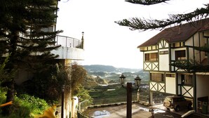 A traditional building with a balcony overlooking a scenic landscape. - Copthorne Hotel Cameron Highlands (Brinchang)