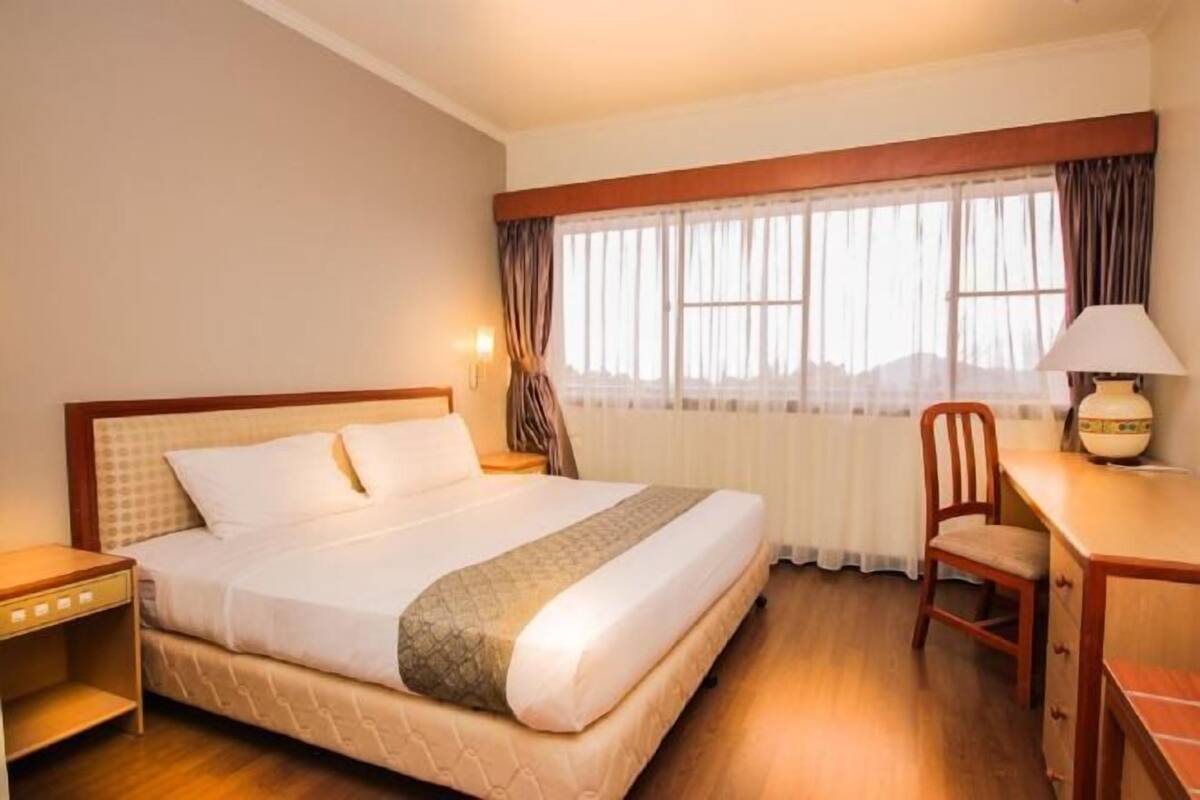 In-room safe, desk, blackout curtains, iron/ironing board (on request)