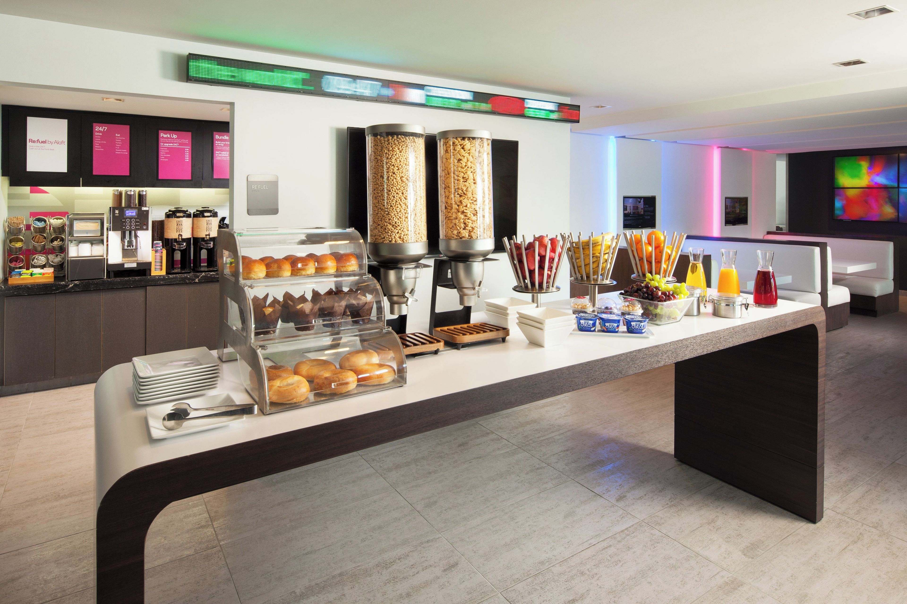A breakfast buffet with various food items and a coffee station.