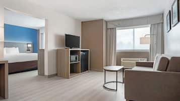 Suite, 1 King Whirlpool Tub Refined Non Smoking 2 Person Sofa Bed | Living area | Flat-screen TV