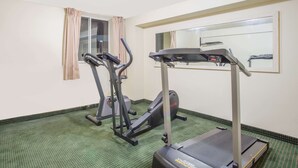 A gym with treadmills, ellipticals, and a mirrored wall. - Days Inn by Wyndham Custer (Custer)