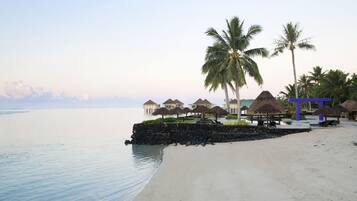 On the beach, white sand, beach towels, snorkeling