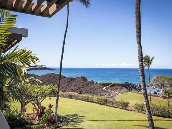 A golf course with a view of the ocean and a rocky coastline.