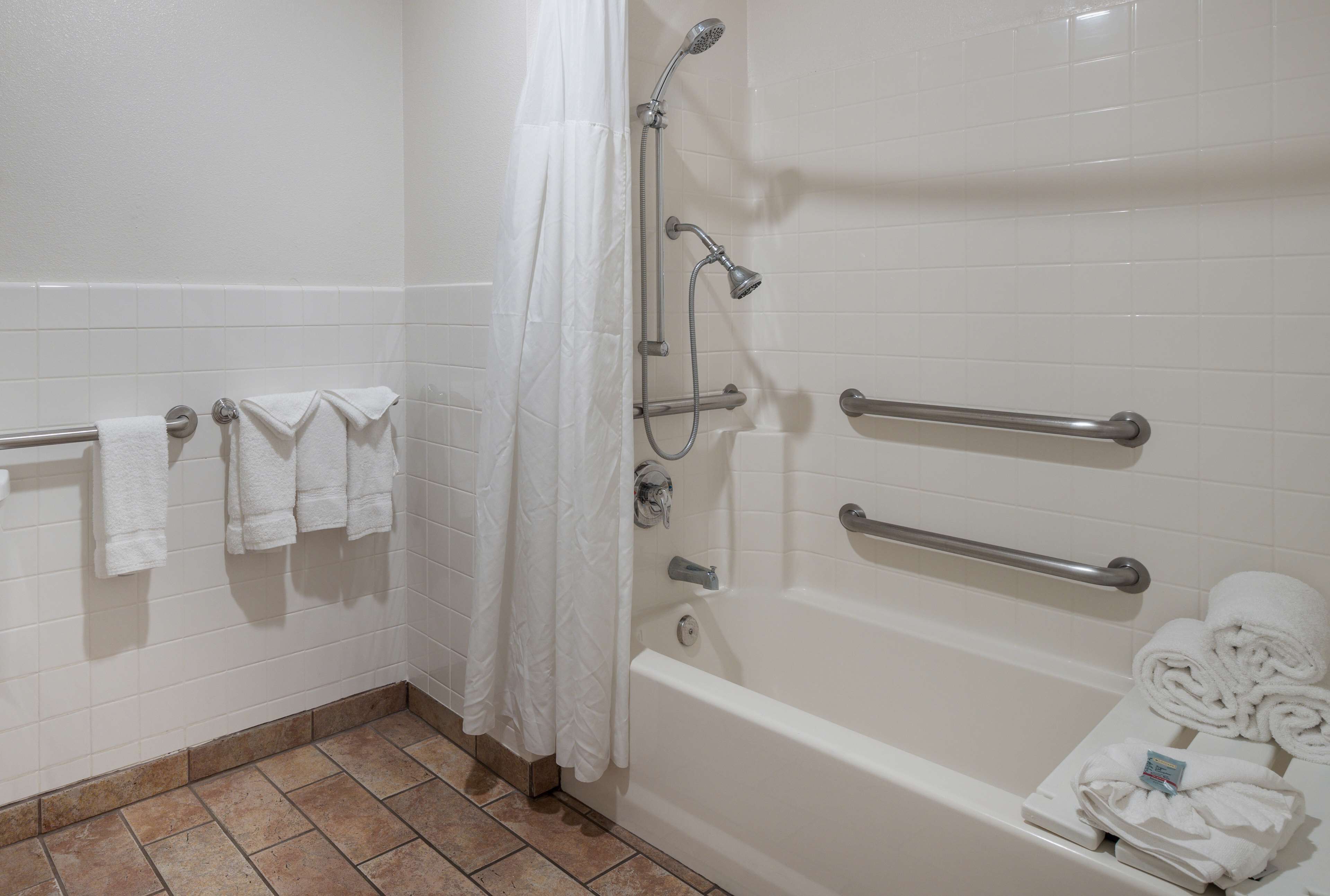 combined shower/bathtub, free toiletries, hair dryer, towels