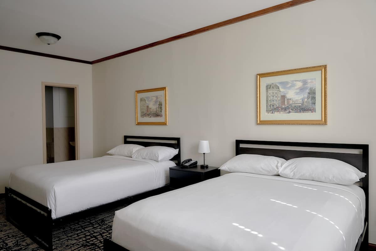 Gold, 2 Full Beds | Down comforters, in-room safe, individually decorated