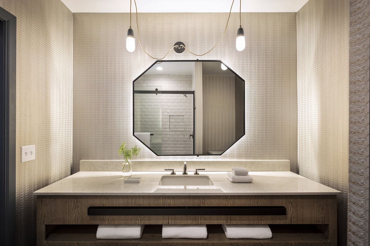 designer toiletries, hair dryer, bathrobes, towels