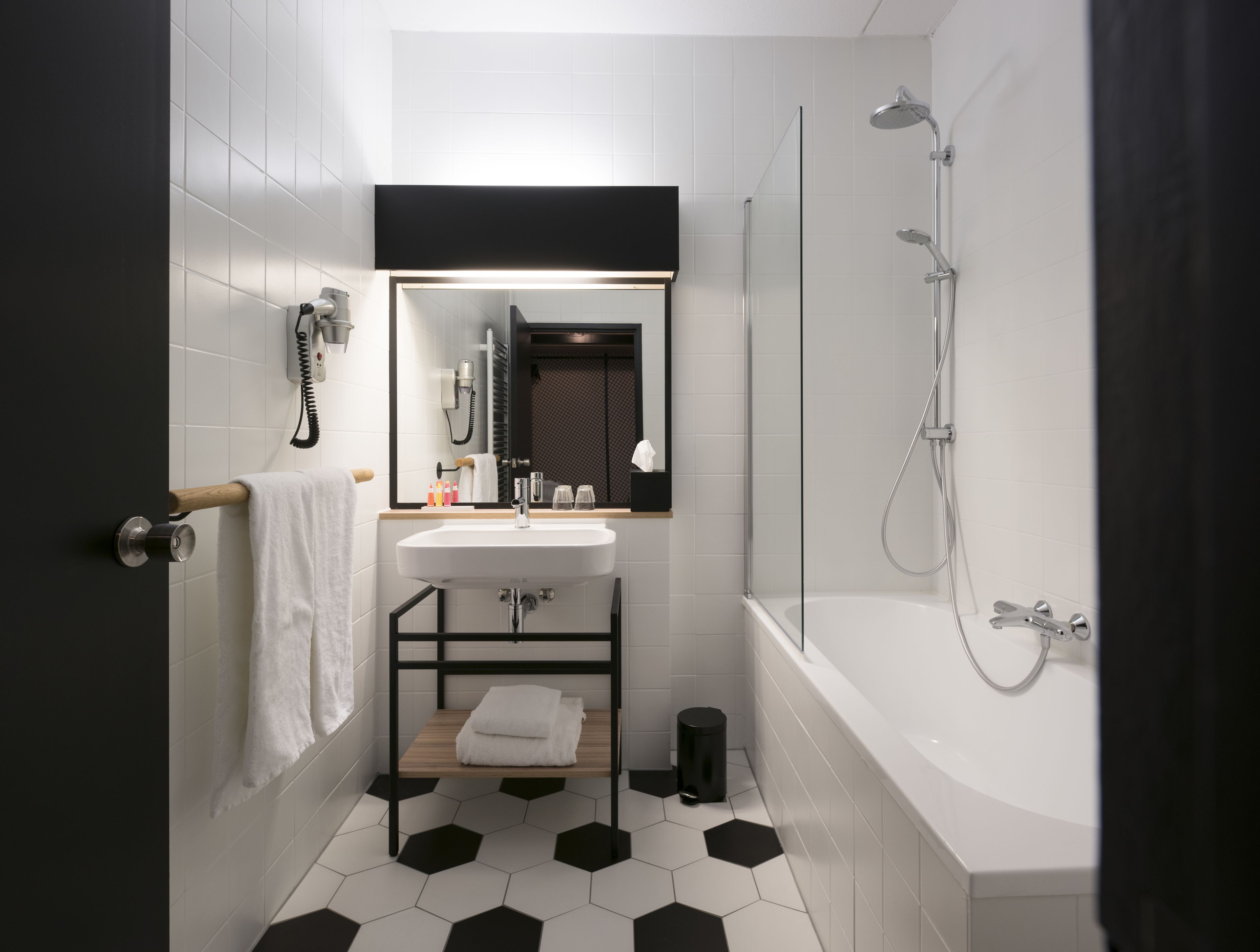 designer toiletries, hair dryer, towels, soap