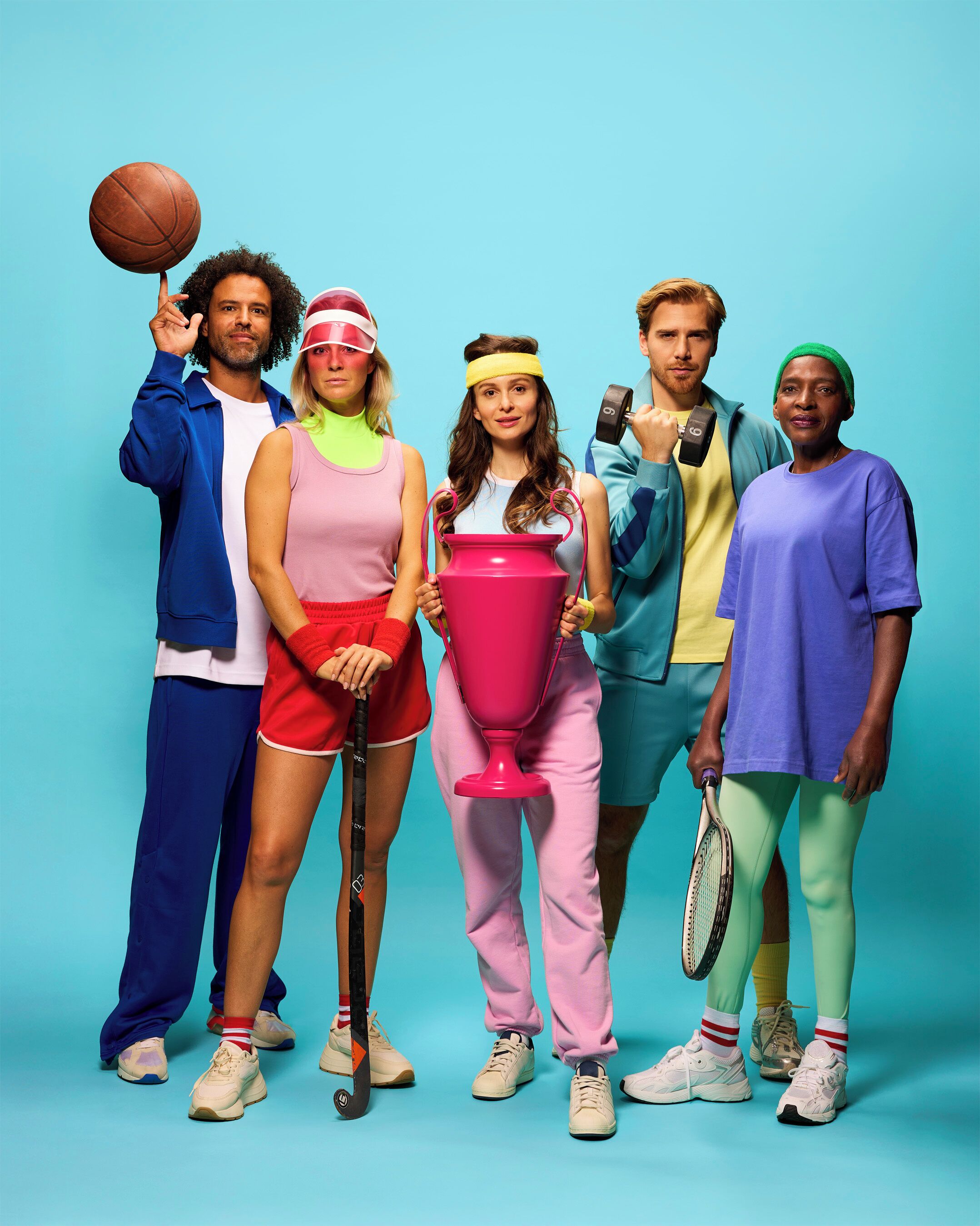 A group of people in colorful athletic wear against a blue background.