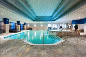 Indoor pool, open 7:00 AM to 11:00 PM, pool loungers