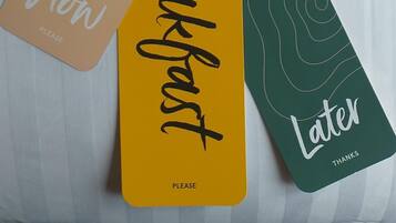 Two hangtags with 'Now' and 'Later' text, and 'Please' on a white background.