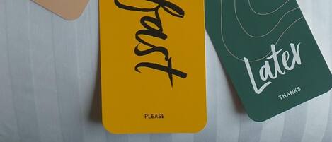 Two hangtags with 'Now' and 'Later' text, and 'Please' on a white background.