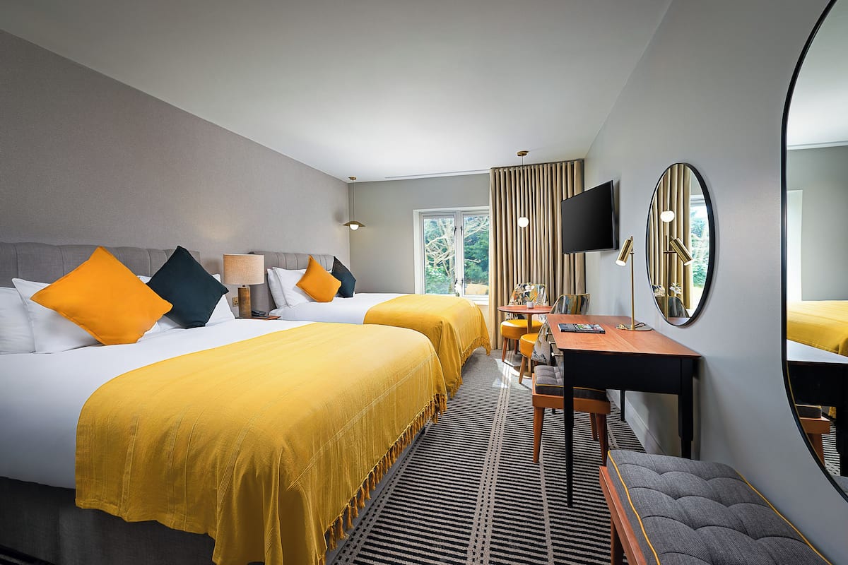 Premium bedding, desk, laptop workspace, free WiFi