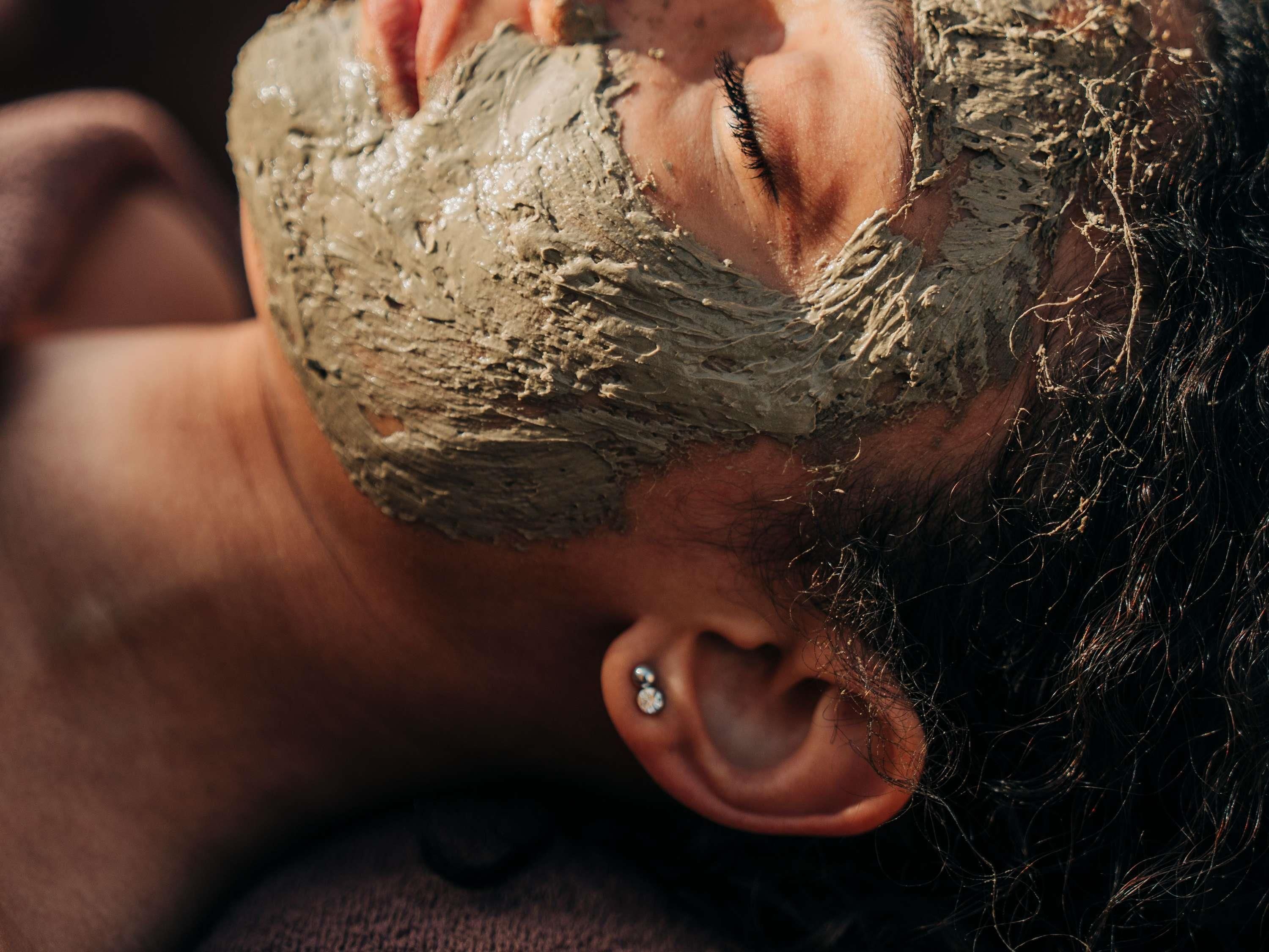 A person with a beard and ear piercing.