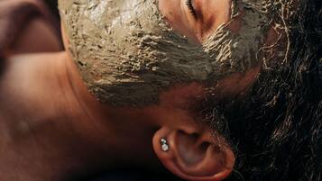 A person with a beard and ear piercing.