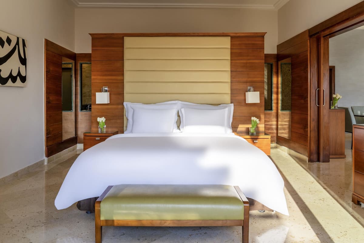 Suite, 1 King Bed, Sea View | 1 bedroom, free minibar items, in-room safe, desk