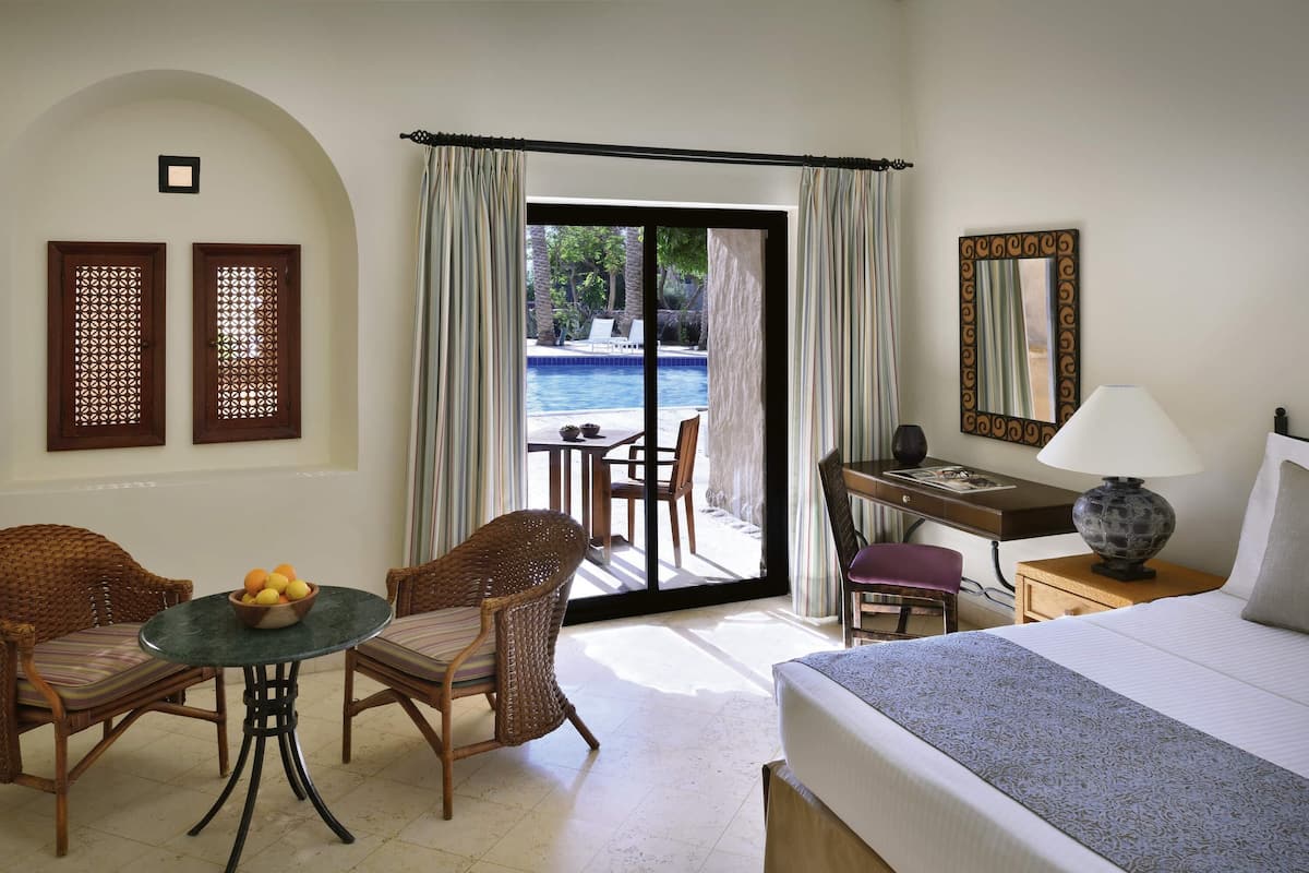 Premium Room, 1 King Bed, Pool View | 1 bedroom, free minibar items, in-room safe, desk