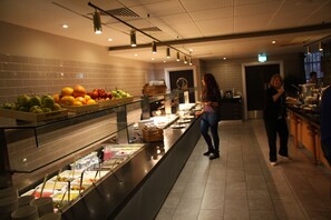 A buffet area with various food items and a counter. - Crowne Plaza Liverpool City Centre by IHG (Liverpool)