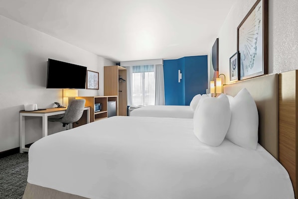 Premium bedding, pillowtop beds, desk, laptop workspace