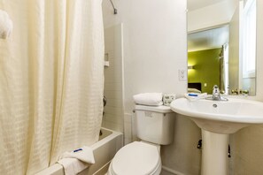 Combined shower/bathtub, towels, toilet paper