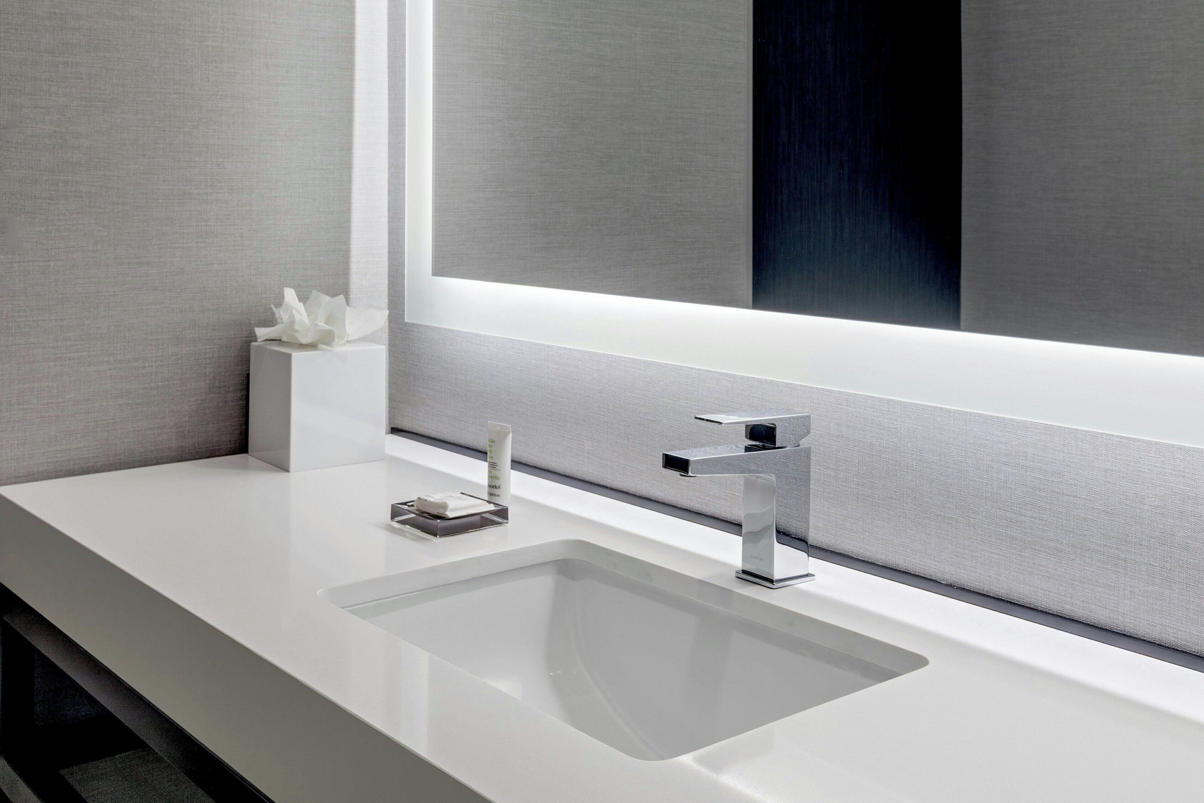 combined shower/bathtub, designer toiletries, hair dryer, towels