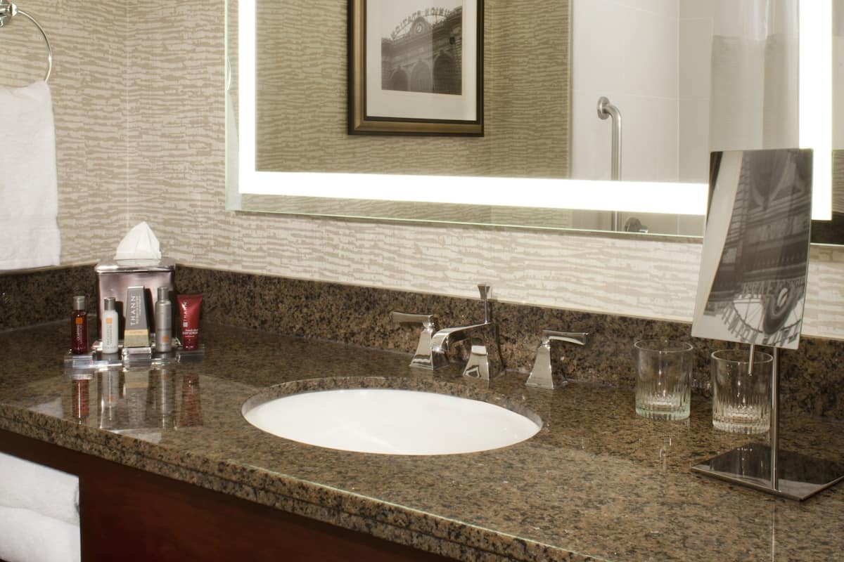 Combined shower/tub, designer toiletries, hair dryer, towels
