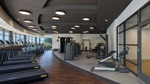 A modern gym with treadmills, elliptical machines, and weight equipment. - Marriott Denver Airport at Gateway Park (Aurora)