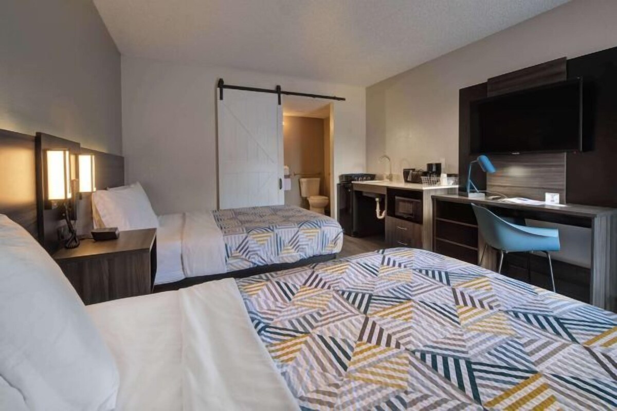 Memory foam beds, desk, laptop workspace, blackout drapes