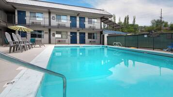 Seasonal outdoor pool, open 10:00 AM to 10:00 PM, pool umbrellas
