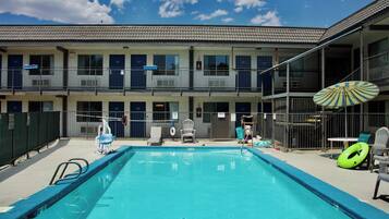Seasonal outdoor pool, open 10:00 AM to 10:00 PM, pool umbrellas