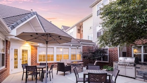 A patio with outdoor furniture, a fire pit, and a grill. - Residence Inn by Marriott Denver Southwest/Lakewood (Lakewood)